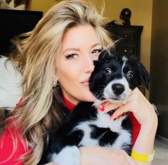 Geralynn holding a dog